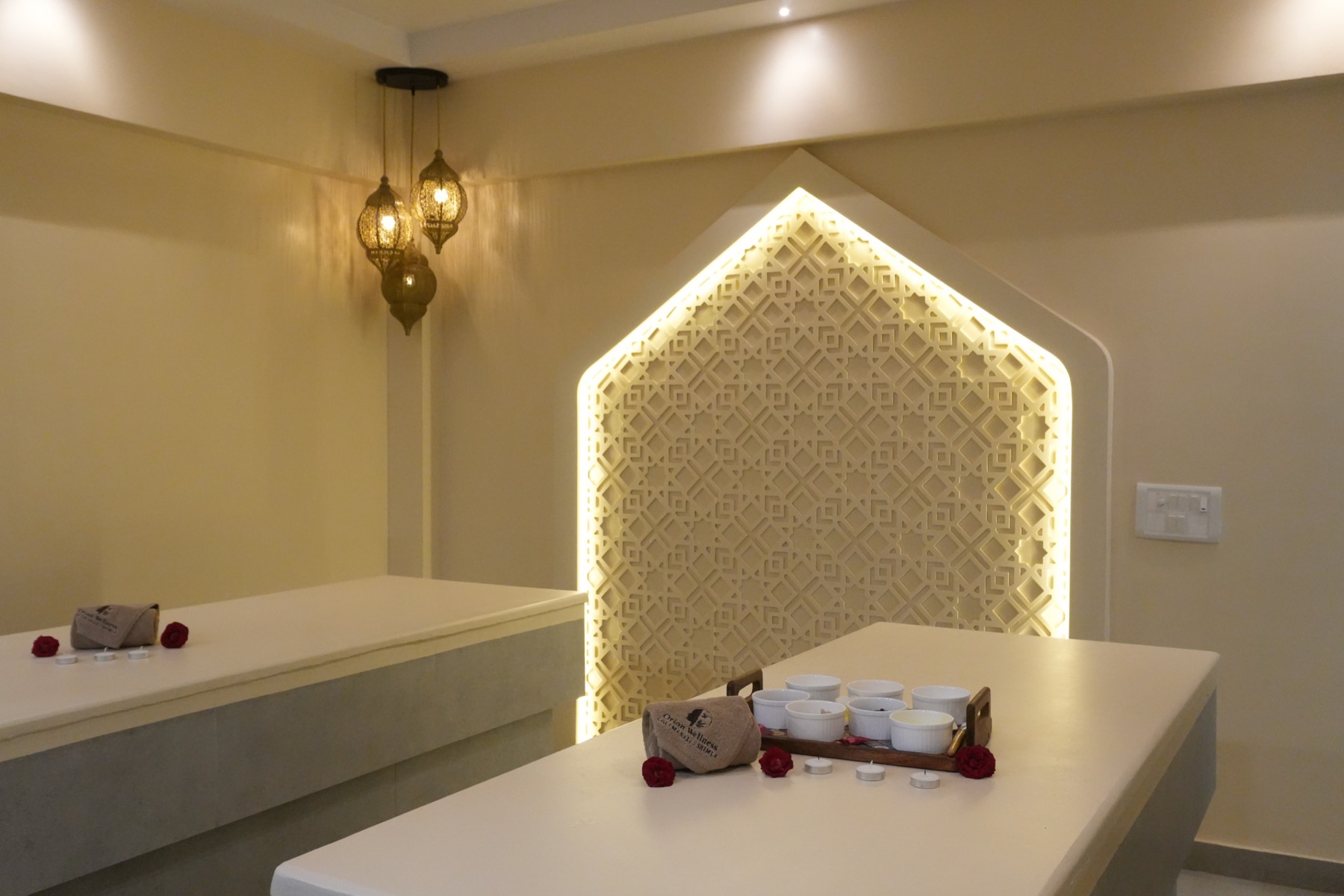 The Moroccan bath room at Orion Punawale, lit by its jali arch
